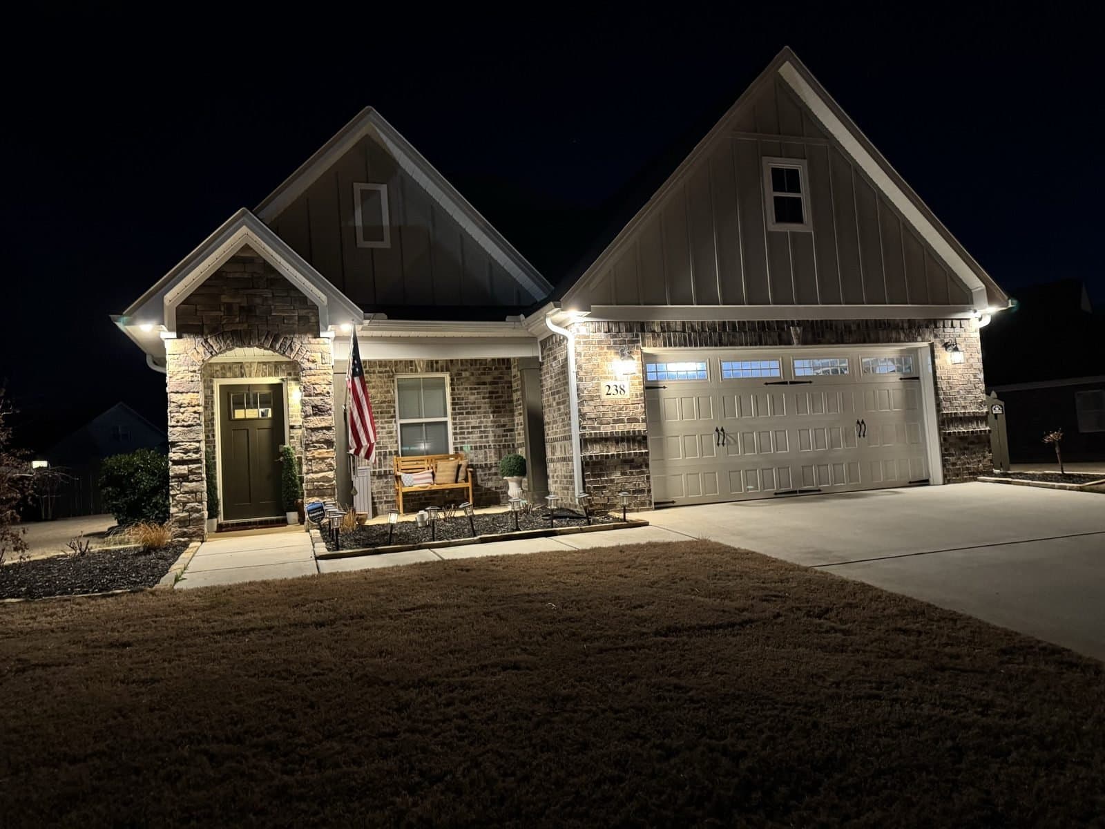 Home in the Huntsville, AL area glowing at night with soffit lighting installed by Spark Medic